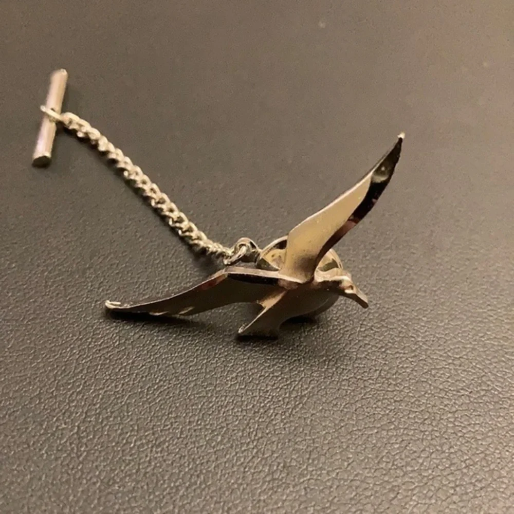 Silver tone tie tack